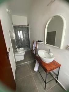 a bathroom with two sinks and a mirror at Domus Petra in Rocca Cilento