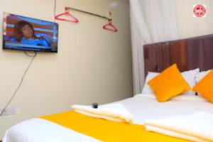 En eller flere senge i et værelse på Machakos Inn Hotel