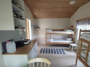 Postel nebo postele na pokoji v ubytování Selholmens Camping