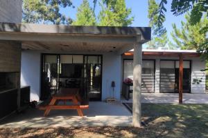 a pavilion with a picnic table on a patio at El Paraíso - Casa rural en zona termal de Concordia in Concordia +32 photos
