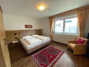 Posteľ alebo postele v izbe v ubytovaní Haus Waldheim und Dependance