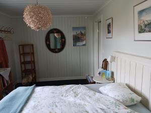 Postel nebo postele na pokoji v ubytování Faarlund BandB