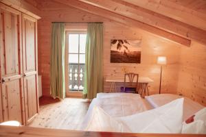 Postel nebo postele na pokoji v ubytování Chalet im Grünen in Seenähe