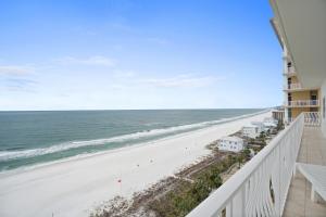 a view of the beach from the balcony of a condo at Coral Reef Resort by Panhandle Getaways in Panama City Beach