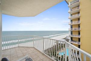 a balcony with a view of the beach at Coral Reef Resort by Panhandle Getaways in Panama City Beach