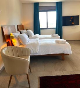 Voodi või voodid majutusasutuse Dar Al Mauge Boutique Hotel with Outdoor Pool toas