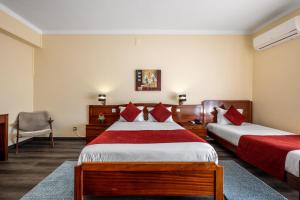Uma cama ou camas num quarto em Hotel Colmeia