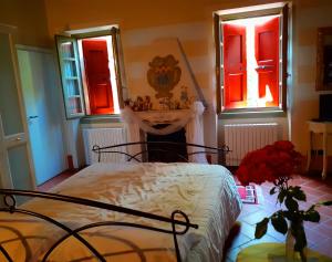 Postel nebo postele na pokoji v ubytování Cascina CORTEPRIMAVERA, B&B del Baliot + 37 fotografií