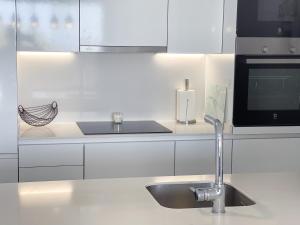 Kuchyňa alebo kuchynka v ubytovaní Pure South Residence