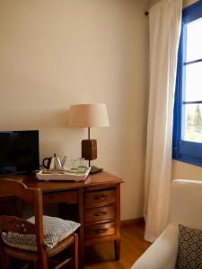 TV a/nebo společenská místnost v ubytování Hostal de la Plaça - Hotel Boutique