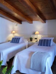 Postel nebo postele na pokoji v ubytování Hostal de la Plaça - Hotel Boutique
