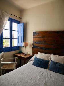 Postel nebo postele na pokoji v ubytování Hostal de la Plaça - Hotel Boutique