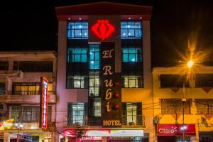 a building with a sign with a heart on it at Hotel El Rubi in Huaraz