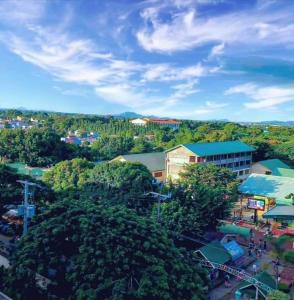an overhead view of a city with trees and buildings at Happy Stays A - Sunset View at SMDC Hope Residences in Trece Martires