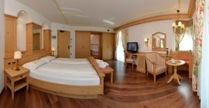 Rúm í herbergi á Hotel B&B Andreas
