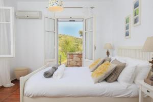 Кровать или кровати в номере Neritos House