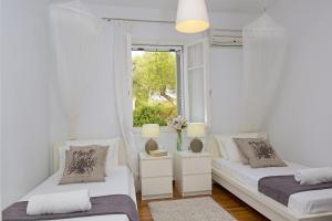 Кровать или кровати в номере Neritos House