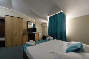 Postel nebo postele na pokoji v ubytování Hotel Cora