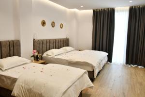 Postel nebo postele na pokoji v ubytování Elite Hotel
