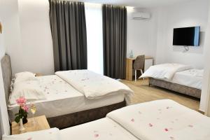 Postel nebo postele na pokoji v ubytování Elite Hotel