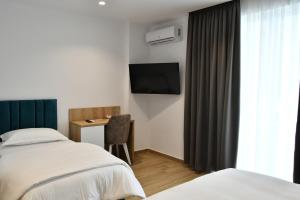 Postel nebo postele na pokoji v ubytování Elite Hotel