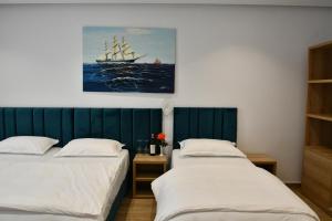 Postel nebo postele na pokoji v ubytování Elite Hotel