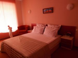Postel nebo postele na pokoji v ubytování Art Guest House Orchidea