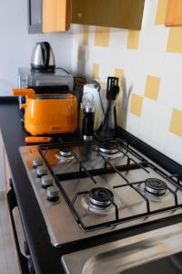 a stove top oven with a pot on top of it at ADRIA ART APARTMENTS 1 in Adria