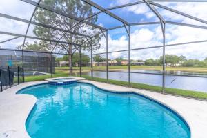 a swimming pool in a large building with a pond at 17637 Silver Creek in Orlando