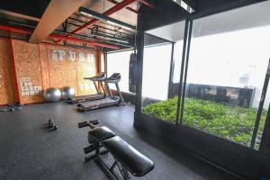 a gym with a large window and a punching bag at Luxury Apartment in Magdalena 2BR limit San Isidro in Lima
