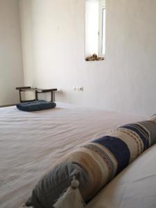 Postel nebo postele na pokoji v ubytování Asimina's beach house