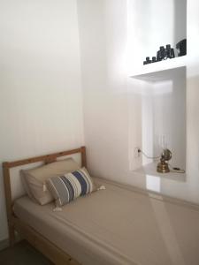 Postel nebo postele na pokoji v ubytování Asimina's beach house