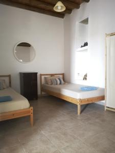 Postel nebo postele na pokoji v ubytování Asimina's beach house
