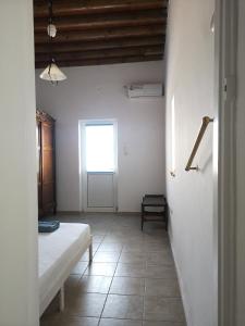 Postel nebo postele na pokoji v ubytování Asimina's beach house