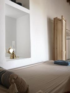 Postel nebo postele na pokoji v ubytování Asimina's beach house