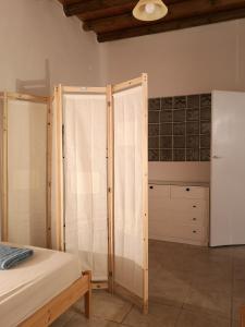 Postel nebo postele na pokoji v ubytování Asimina's beach house