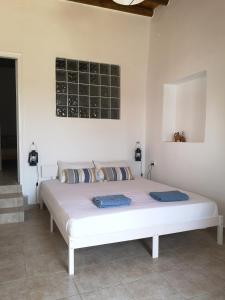 Postel nebo postele na pokoji v ubytování Asimina's beach house