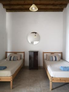 Postel nebo postele na pokoji v ubytování Asimina's beach house