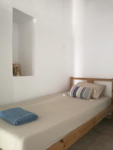 Postel nebo postele na pokoji v ubytování Asimina's beach house