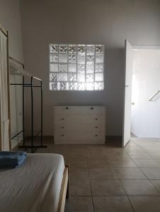 Postel nebo postele na pokoji v ubytování Asimina's beach house