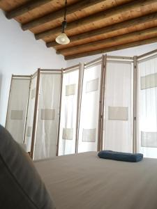 Postel nebo postele na pokoji v ubytování Asimina's beach house