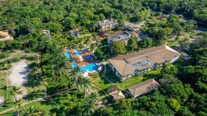 an aerial view of a house with a swimming pool at Ilheus North Hotel in Ilhéus