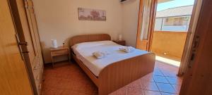 Posteľ alebo postele v izbe v ubytovaní San Carlo - private beach