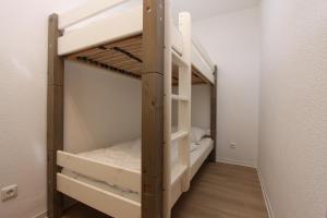 Ένα ή περισσότερα κρεβάτια σε δωμάτιο στο Grömitz- Center II App 37 inkl WLAN