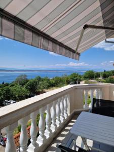 a balcony with a view of the ocean at Apartments Velic in Crikvenica