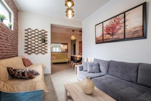 a living room with a couch and a table at Pepe home in Nafplio