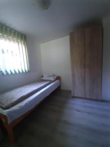 Postel nebo postele na pokoji v ubytování Apartman TATTOO R LUX