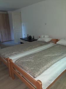 Postel nebo postele na pokoji v ubytování Apartman TATTOO R LUX