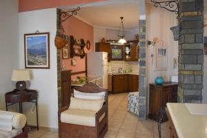 a kitchen and living room with a refrigerator at The GL place in Iraklitsa