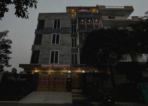 a building with a sign on the front of it at Townhouse 22956 Hotel Grand Residency in Greater Noida